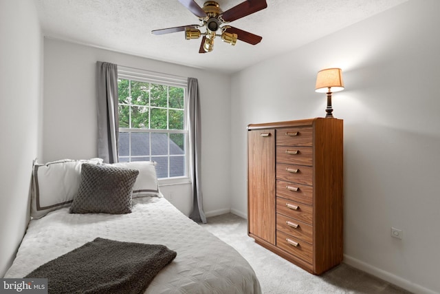 9269 Pigeonwing Pl, Columbia, MD 21045 - bedroom with light carpet, baseboards, and ceiling fan