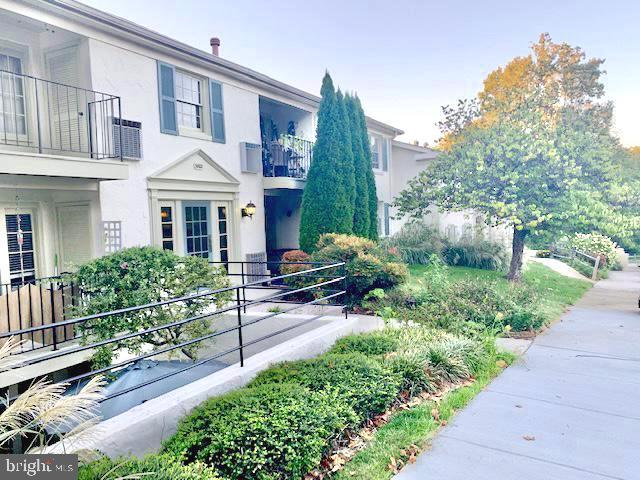 5802 Torington Dr Unit H, Springfield, VA 22152 - view of front of house featuring stucco siding and a balcony