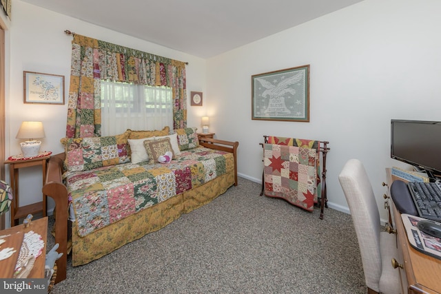 bedroom with carpet flooring and baseboards