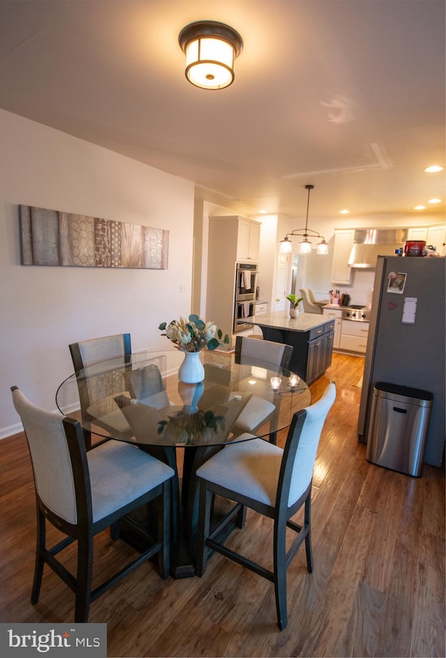 dining space featuring wood finished floors