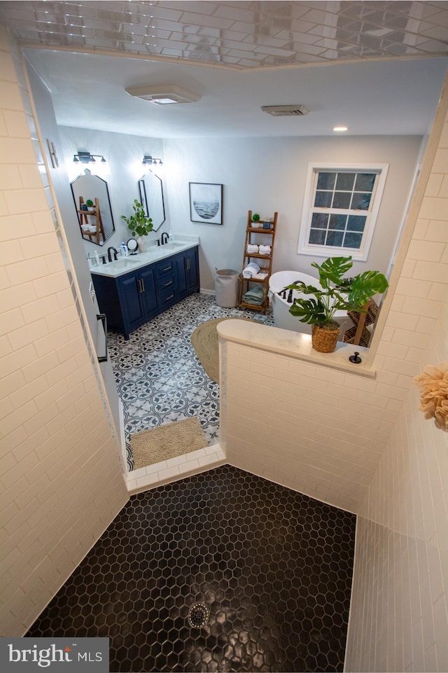 bathroom featuring toilet and double vanity