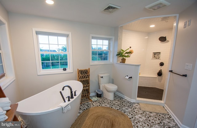 bathroom with a soaking tub, toilet, recessed lighting, walk in shower, and baseboards