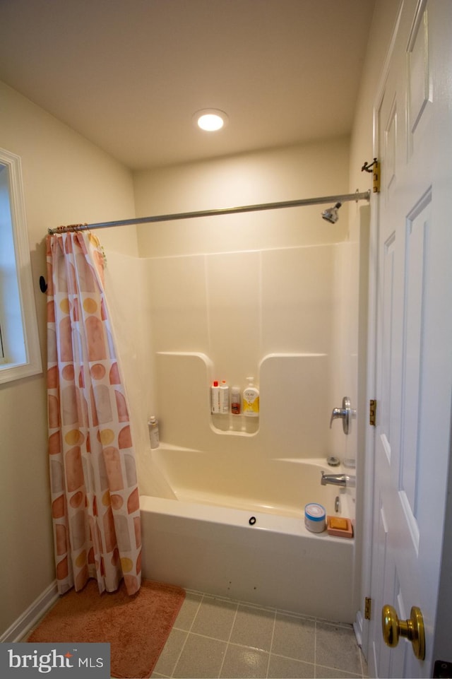 bathroom with shower / tub combo with curtain and recessed lighting