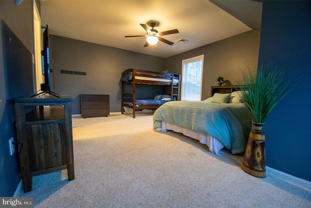 carpeted bedroom with baseboards and ceiling fan