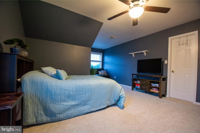 carpeted bedroom with lofted ceiling and a ceiling fan