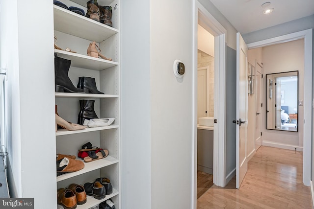 hallway with wood finished floors