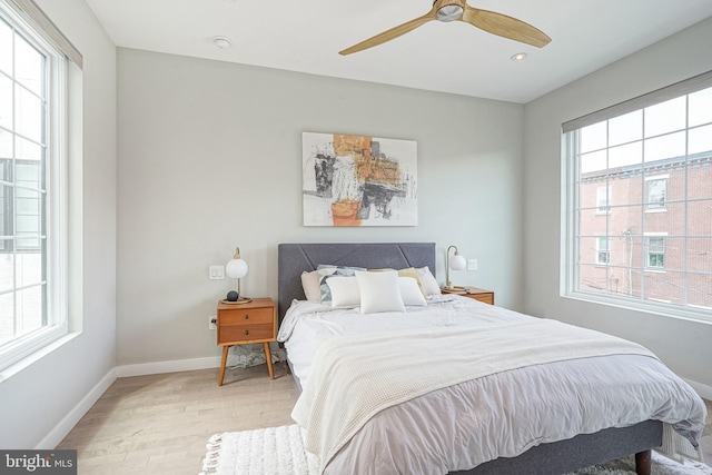 bedroom featuring light wood-style flooring, baseboards, recessed lighting, and a ceiling fan