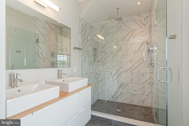 bathroom with a stall shower, recessed lighting, and vanity