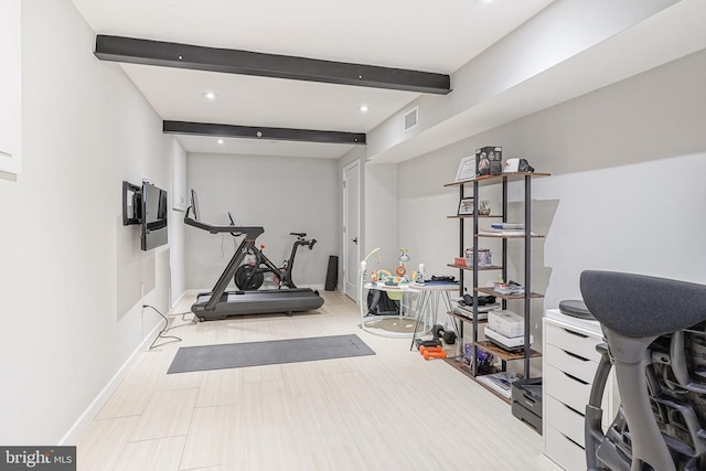 exercise area featuring baseboards and recessed lighting