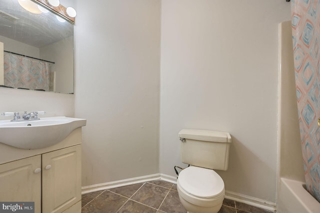 full bath featuring baseboards, tile patterned floors, curtained shower, vanity, and toilet