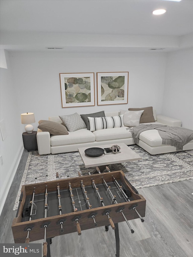 living room featuring wood finished floors and recessed lighting