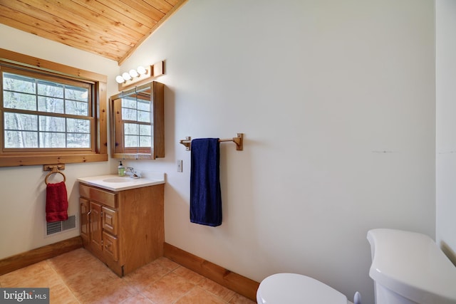 32 Black Bear Rd, Albrightsville, PA 18210 - bathroom featuring toilet, vaulted ceiling, wooden ceiling, baseboards, and tile patterned flooring