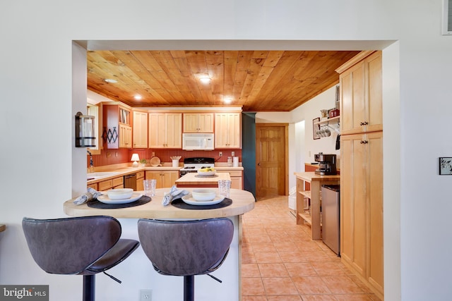 32 Black Bear Rd, Albrightsville, PA 18210 - kitchen featuring white microwave, range, wood ceiling, light countertops, and a peninsula