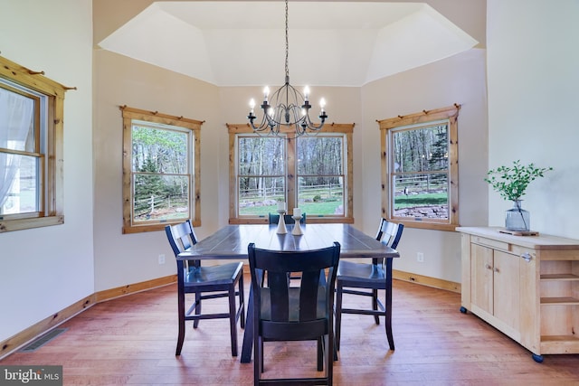 32 Black Bear Rd, Albrightsville, PA 18210 - dining space featuring a chandelier, light wood finished floors, baseboards, and vaulted ceiling