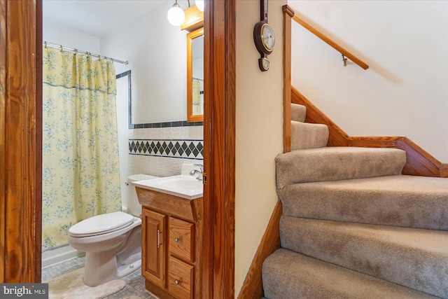 full bathroom with tile walls, vanity, a shower with curtain, toilet, and tile patterned floors