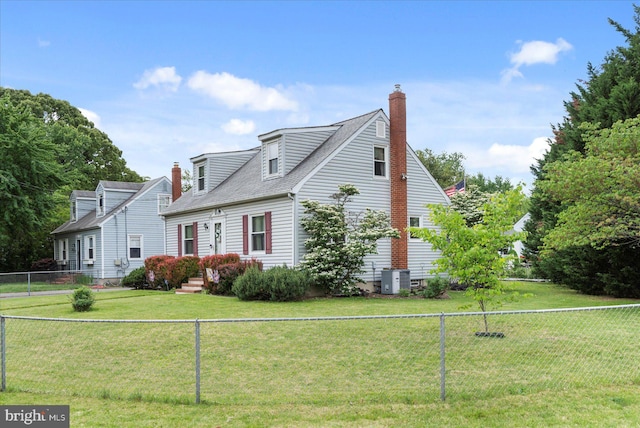 view of home's exterior featuring a chimney, roof with shingles, and central AC