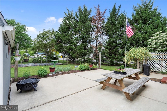view of patio / terrace featuring outdoor dining space and a fire pit