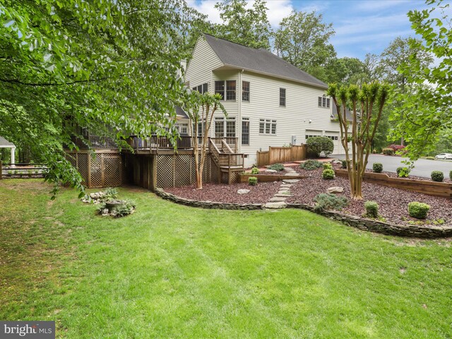 8197 Cottage Rose Ct, Fairfax Station, VA 22039 - back of house with stairs, a wooden deck, a yard, and an attached garage