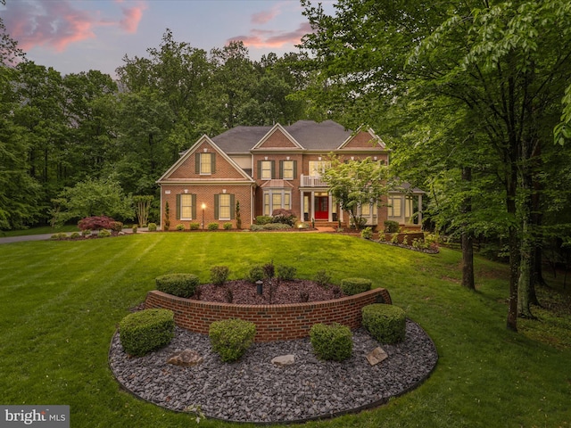 8197 Cottage Rose Ct, Fairfax Station, VA 22039 - colonial home featuring a balcony, a yard, and brick siding