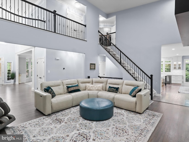 8197 Cottage Rose Ct, Fairfax Station, VA 22039 - living room with a high ceiling, stairs, wood finished floors, baseboards, and recessed lighting