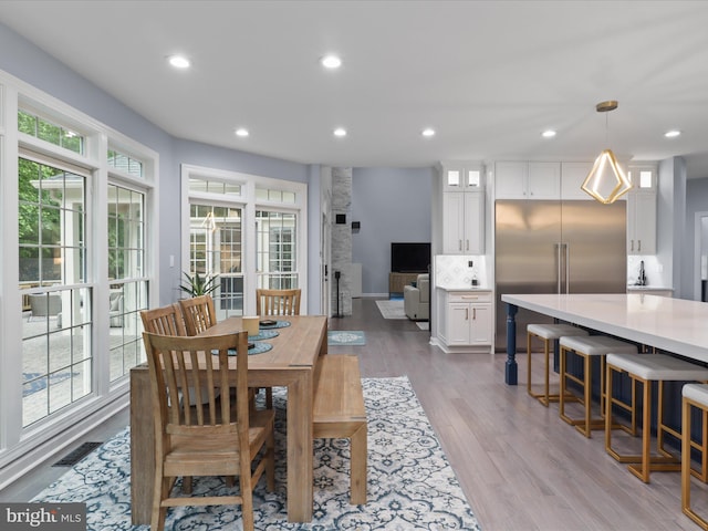 8197 Cottage Rose Ct, Fairfax Station, VA 22039 - dining area with wood finished floors and recessed lighting