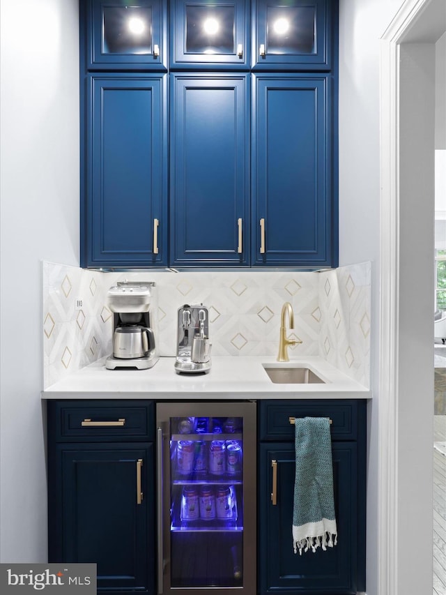 8197 Cottage Rose Ct, Fairfax Station, VA 22039 - indoor wet bar featuring wine cooler and tasteful backsplash