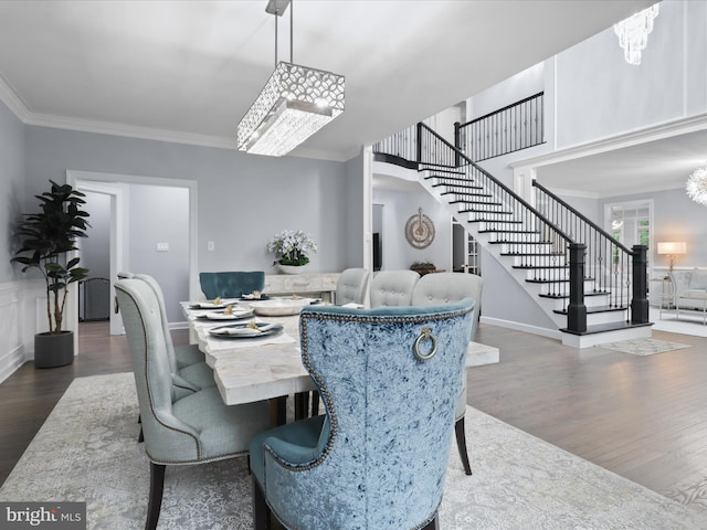 8197 Cottage Rose Ct, Fairfax Station, VA 22039 - dining area featuring stairway, wood finished floors, crown molding, a chandelier, and baseboards