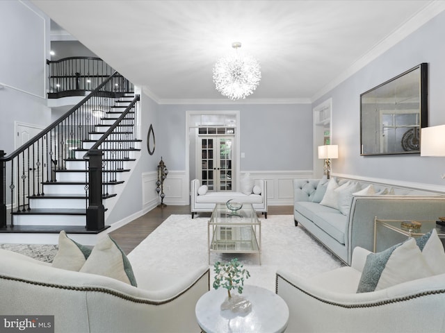 8197 Cottage Rose Ct, Fairfax Station, VA 22039 - living room with wood finished floors, a chandelier, stairs, crown molding, and a wainscoted wall