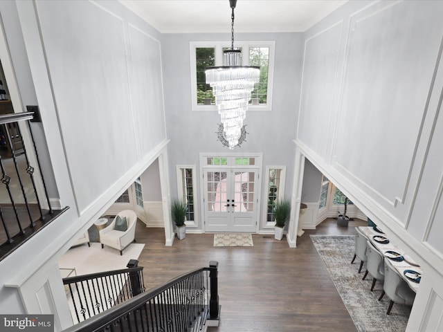 8197 Cottage Rose Ct, Fairfax Station, VA 22039 - foyer with a chandelier, wood finished floors, ornamental molding, french doors, and a decorative wall