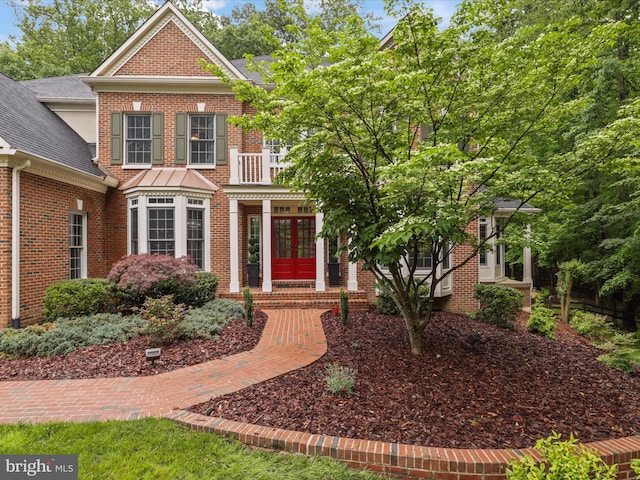 8197 Cottage Rose Ct, Fairfax Station, VA 22039 - georgian-style home featuring french doors, brick siding, a balcony, and roof with shingles
