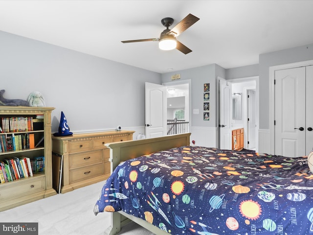 8197 Cottage Rose Ct, Fairfax Station, VA 22039 - carpeted bedroom with wainscoting, a closet, and a ceiling fan