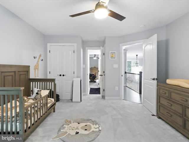 8197 Cottage Rose Ct, Fairfax Station, VA 22039 - bedroom with light colored carpet, a closet, a ceiling fan, and baseboards