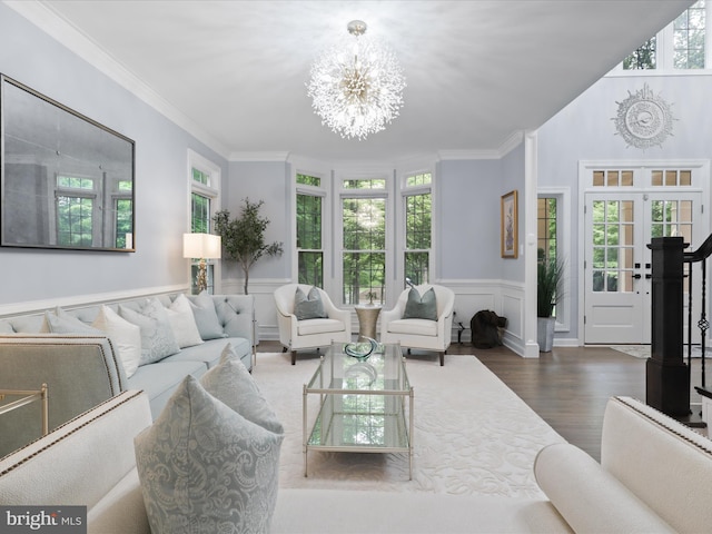 8197 Cottage Rose Ct, Fairfax Station, VA 22039 - living room featuring a chandelier, wood finished floors, ornamental molding, and a wainscoted wall