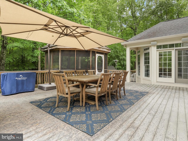 8197 Cottage Rose Ct, Fairfax Station, VA 22039 - wooden deck with a sunroom, outdoor dining area, and view of scattered trees