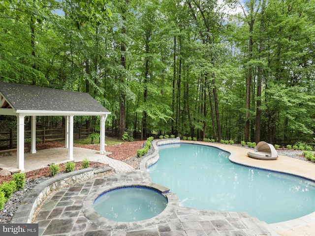 8197 Cottage Rose Ct, Fairfax Station, VA 22039 - view of pool featuring a patio, a pool with connected hot tub, a gazebo, and fence
