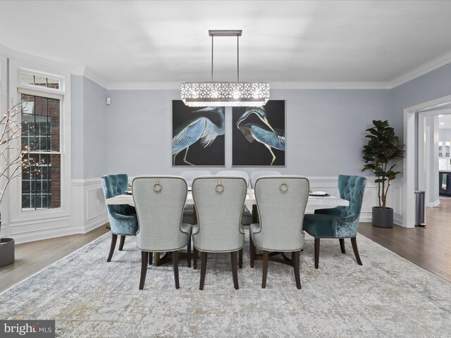 8197 Cottage Rose Ct, Fairfax Station, VA 22039 - dining area with crown molding, wood finished floors, wainscoting, and plenty of natural light