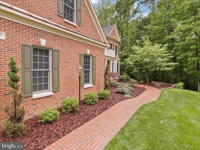 8197 Cottage Rose Ct, Fairfax Station, VA 22039 - view of property exterior featuring a lawn and brick siding