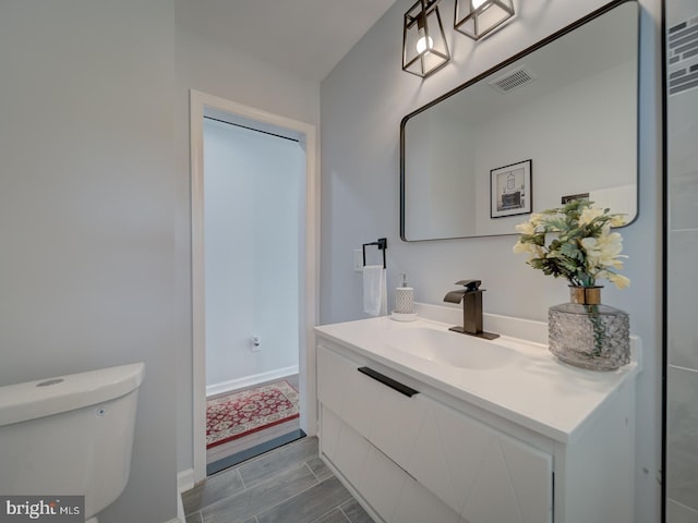 5463 Sands Rd, Lothian, MD 20711 - bathroom featuring toilet and vanity