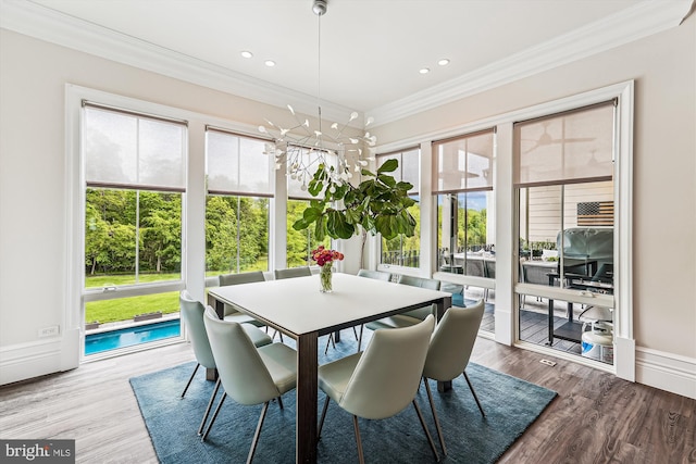 sunroom featuring healthy amount of natural light and a chandelier