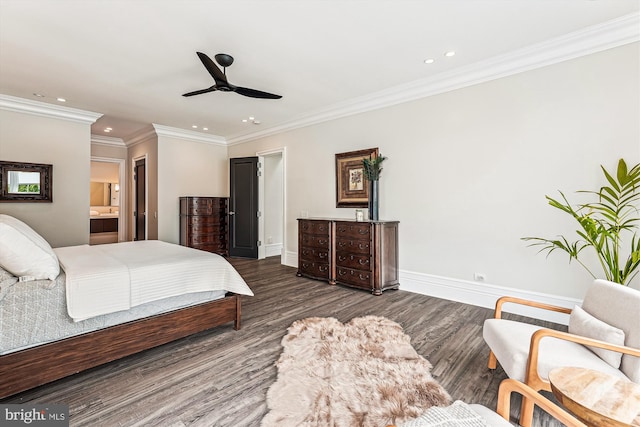 bedroom with recessed lighting, wood finished floors, ornamental molding, baseboards, and ensuite bathroom