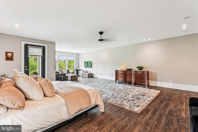 bedroom with wood finished floors, baseboards, recessed lighting, and access to exterior