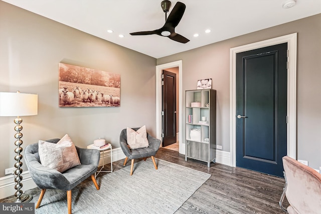 living area featuring wood finished floors, recessed lighting, ceiling fan, and baseboards