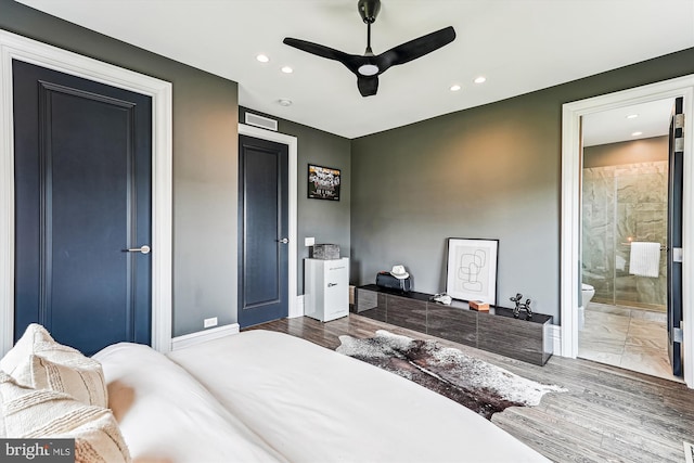 bedroom featuring recessed lighting, baseboards, and ensuite bathroom