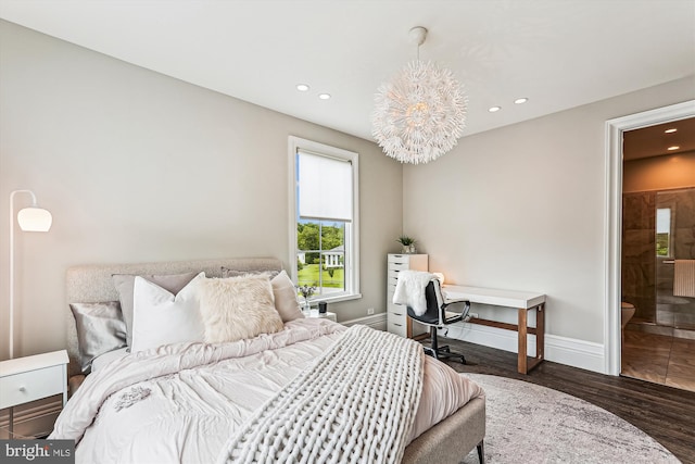 bedroom featuring recessed lighting, wood finished floors, baseboards, a chandelier, and connected bathroom