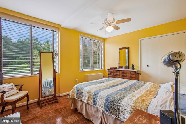 bedroom with baseboards, a closet, and a ceiling fan