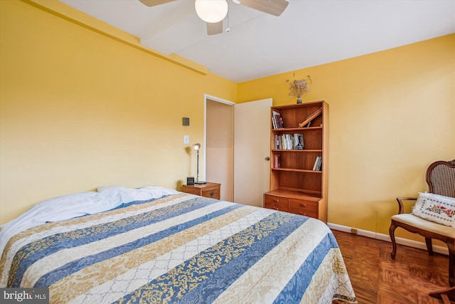 bedroom featuring ceiling fan and baseboards