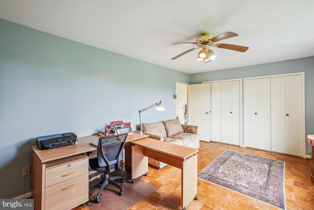 office space featuring a ceiling fan