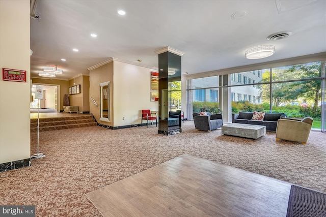lobby with ornamental molding and recessed lighting