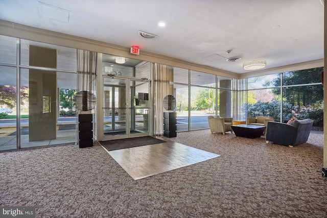 building lobby with expansive windows and crown molding