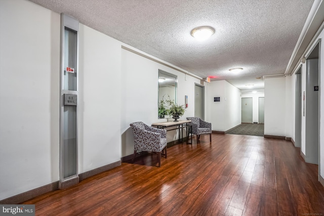 building lobby featuring a textured ceiling